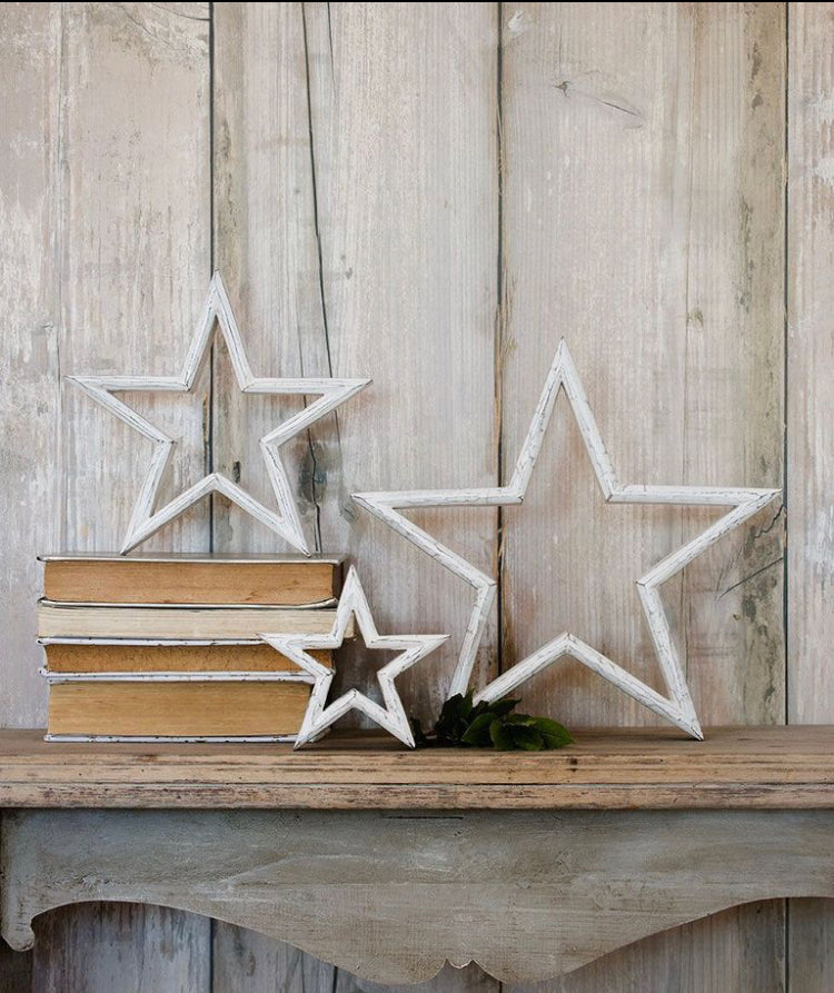 White wooden mantle stars